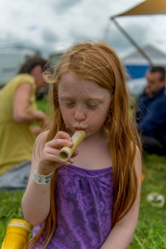 Girl playing bamboo flute